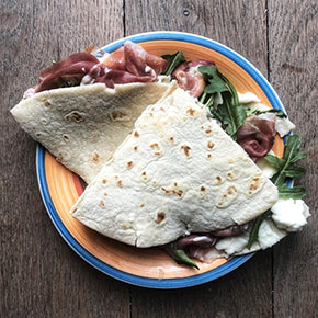 Piadina with Parma ham, stracchino cheese and arugula